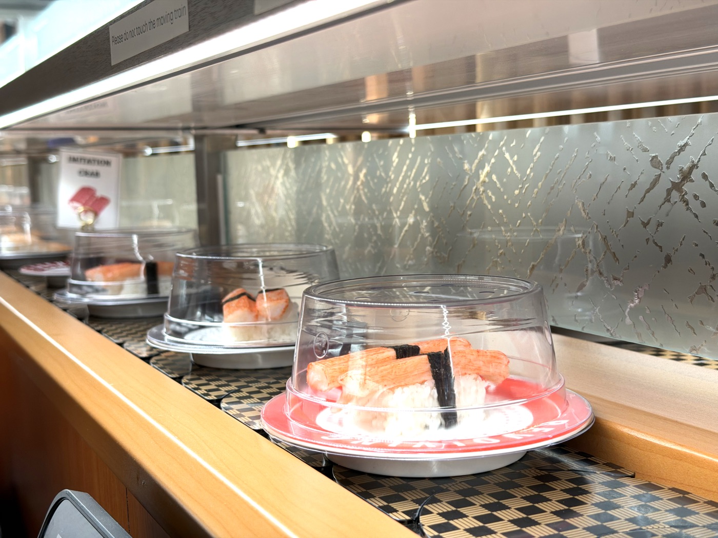 How revolving sushi works Makoto Staten Island — plates on the belt