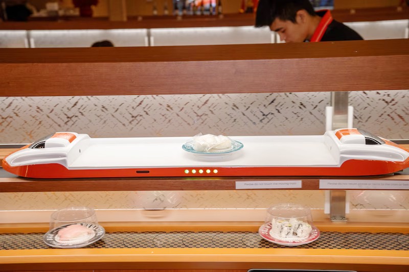 Bullet-train express lane delivering a sushi plate to a guest at Makoto Staten Island